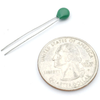 a small green glass ball on a white background